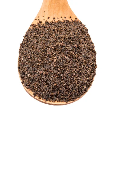 Folhas de chá processadas em colher de madeira — Fotografia de Stock