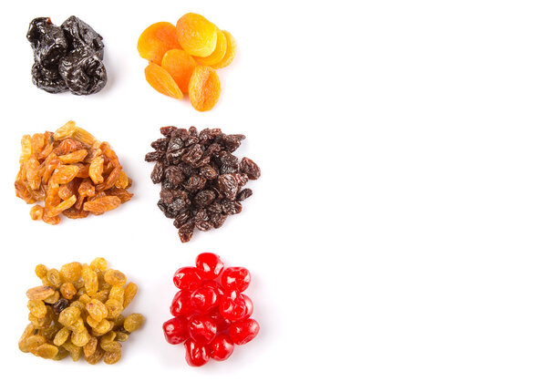 Mix variety of dried fruit over white background