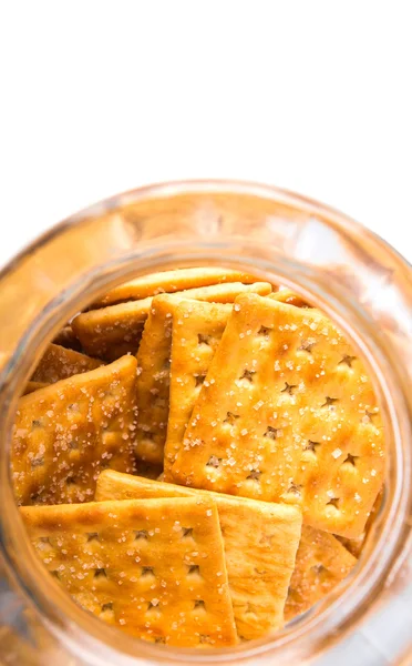 Şeker kraker veya bisküvi kurabiye kavanozu beyaz arka plan üzerinde