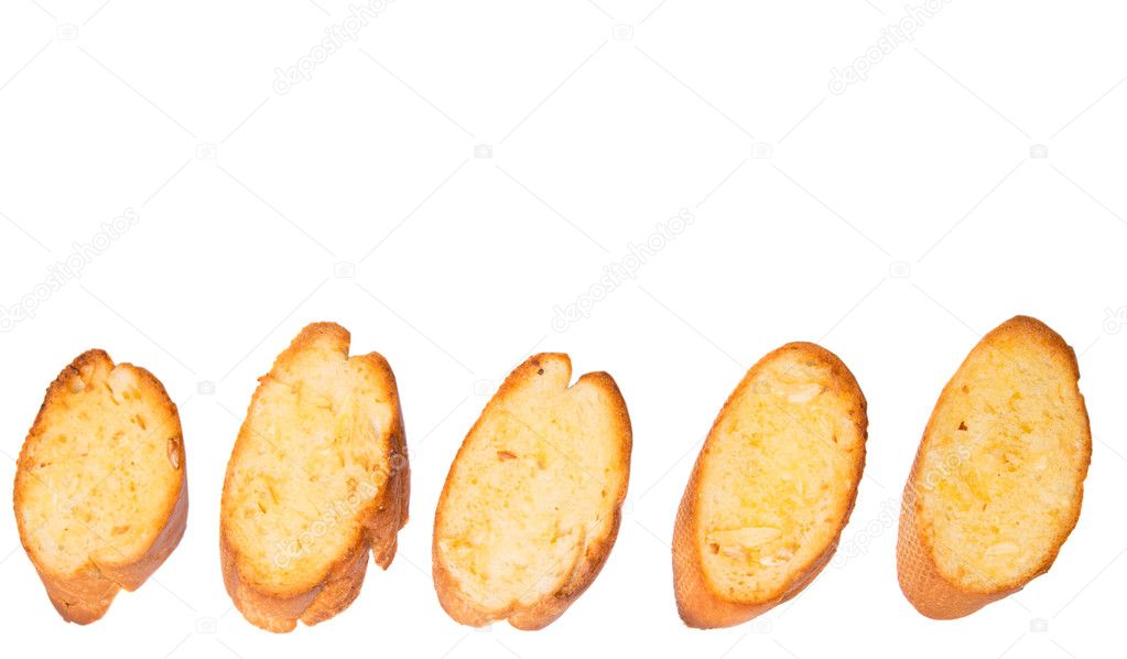 Homemade garlic bread of French baguette  over white background