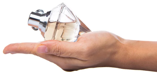 Botella de mano femenina de perfume — Foto de Stock