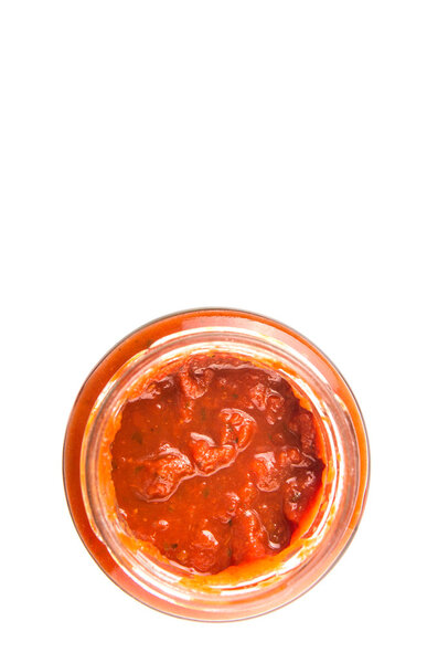 Spaghetti sauce in a jar over white background