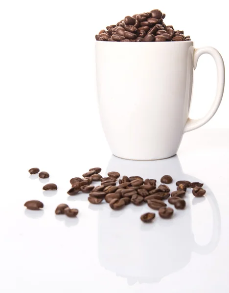 Coffee Beans In Mug Royalty Free Stock Photos