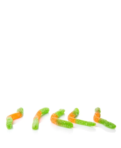 绿色和橙色糖果冻糖条在白色背景下 — 图库照片