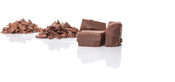 Piezas de chocolate marrón oscuro — Foto de Stock
