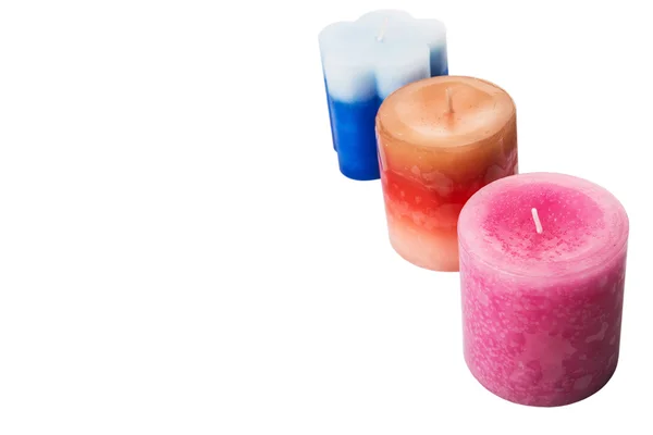 Růžové, modré a hnědé barevné vonné svíčky — Stock fotografie