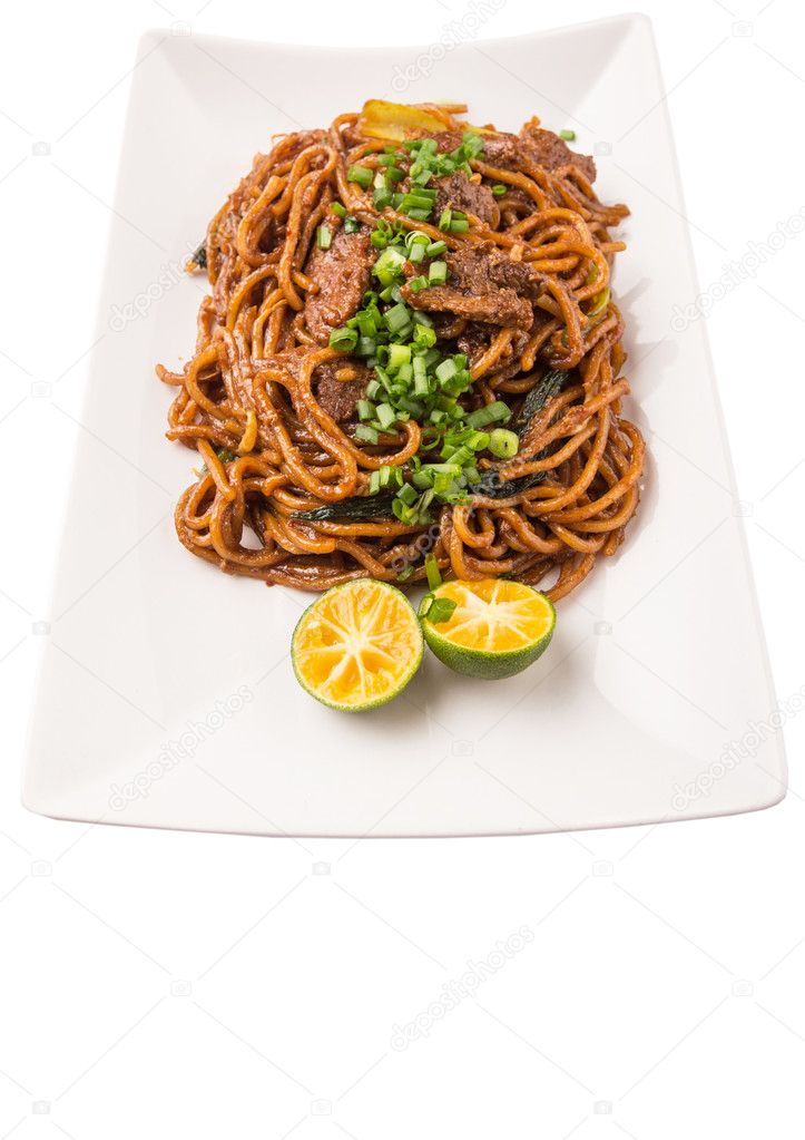 Popular Malaysian stir fried noodles on white plate over white background