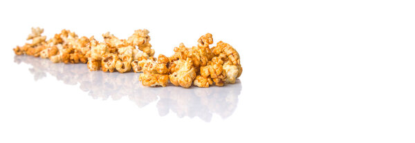 Caramel popcorn over white background