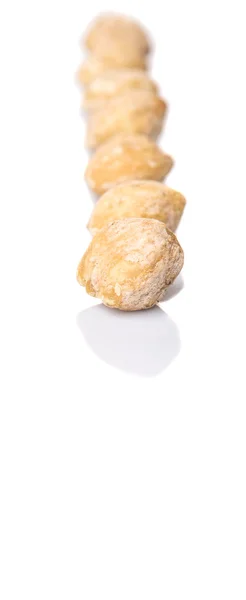 白い背景の上の Candlenuts — ストック写真