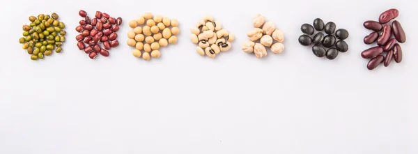 Black eye peas, mung bean, adzuki beans, soy beans, black beans and red kidney beans on white background
