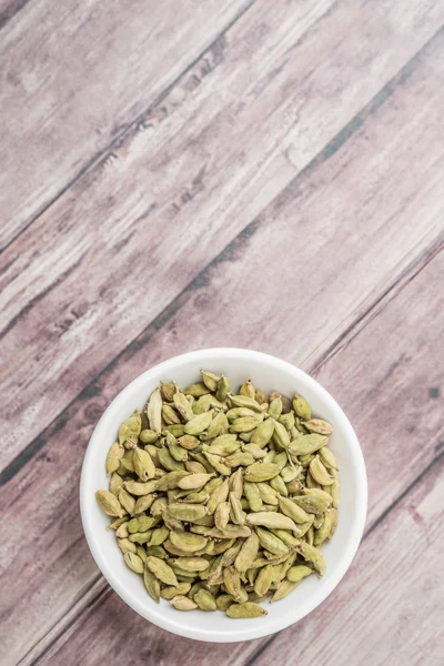 Cardamom Spice White Bowl Weathered Wood Background — Stock Photo, Image