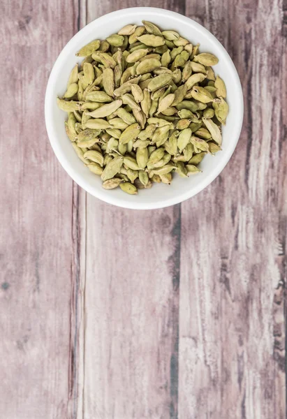 Cardamom Spice White Bowl Weathered Wood Background — Stock Photo, Image