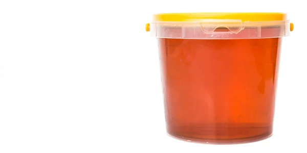 Miel en cubo de plástico — Foto de Stock