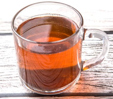 Çayı üzerinde yıpranmış ahşap arka plan