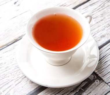 Çay yıpranmış arka plan üzerinde