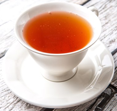 Çay yıpranmış arka plan üzerinde