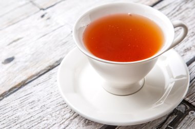 Çay yıpranmış arka plan üzerinde