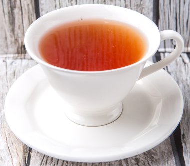 Çay yıpranmış arka plan üzerinde