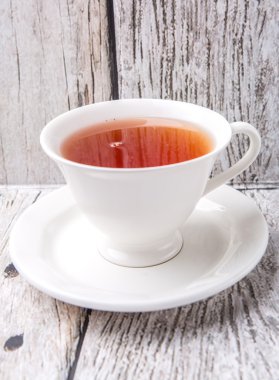 Çay yıpranmış arka plan üzerinde