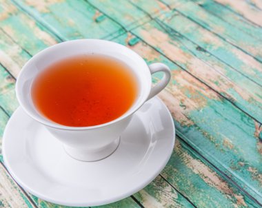 Çay yıpranmış arka plan üzerinde