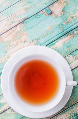 Çay yıpranmış arka plan üzerinde