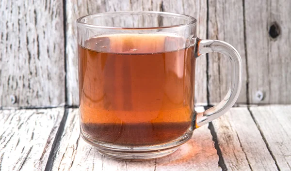 Tea Over Weathered Wooden Background — Stock Photo, Image