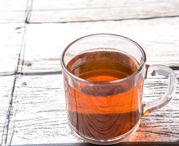 Tea Over Weathered Wooden Background — Stock Photo, Image