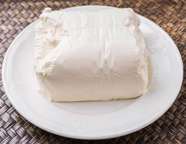 Un bloque de queso crema —  Fotos de Stock