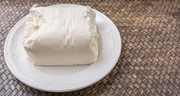 Un bloque de queso crema — Foto de Stock