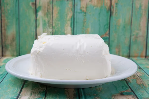 Un blocco di crema di formaggio — Foto Stock