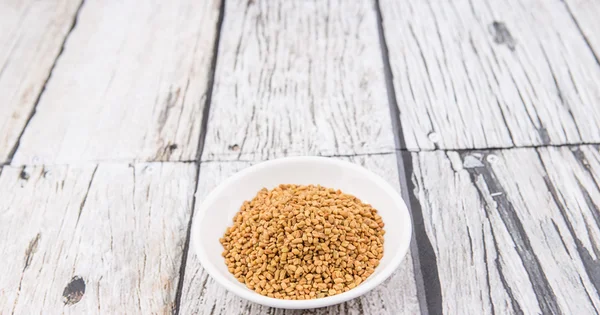 Fenugreek seeds in bowl — Stock Photo, Image