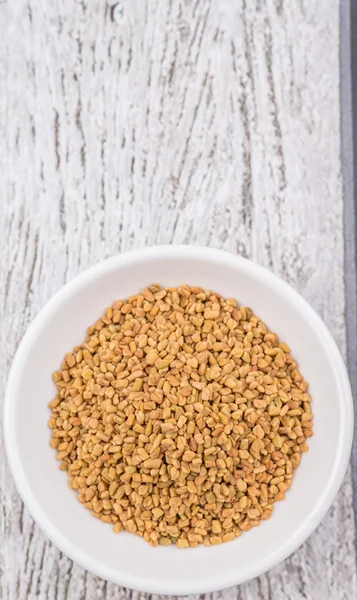 Fenugreek seeds in bowl — Stock Photo, Image
