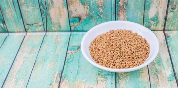 Fenugreek seeds in bowl — Stock Photo, Image