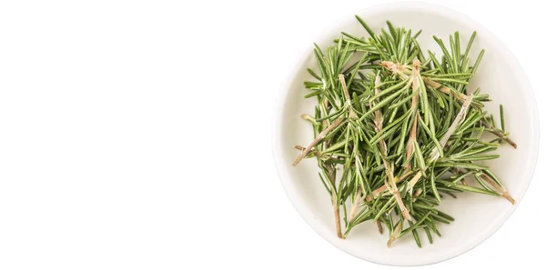 Herbes de romarin dans un bol blanc — Photo