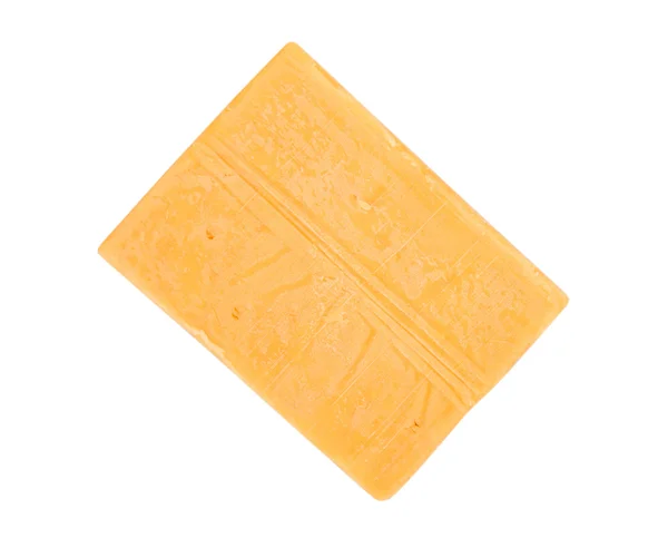 Ein Block Cheddar-Käse — Stockfoto