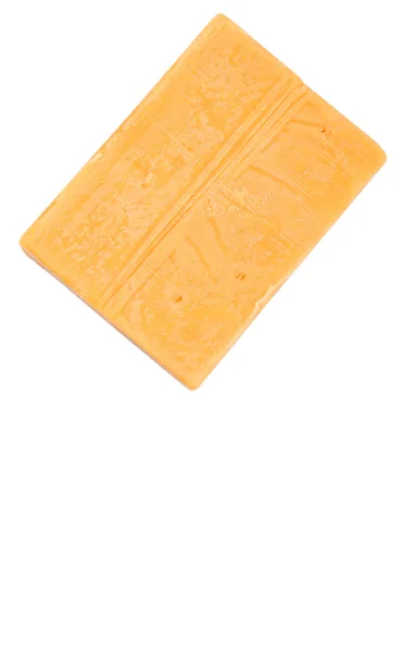 Un bloque de queso cheddar —  Fotos de Stock