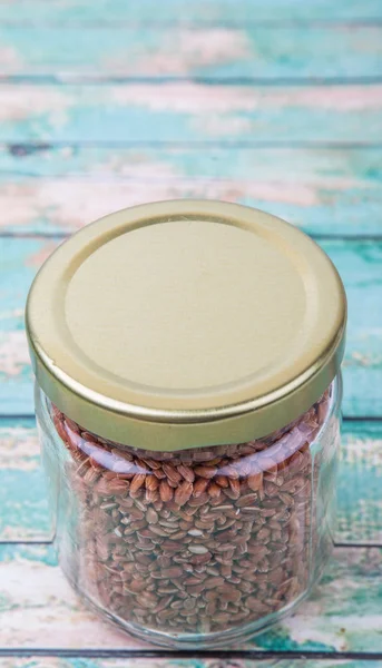 Brown millet in a jar — Stock Photo, Image
