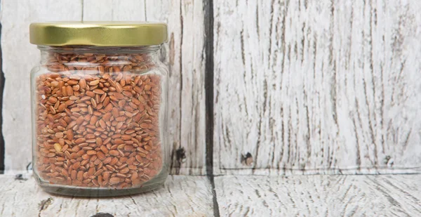 Brown millet in a jar — Stock Photo, Image