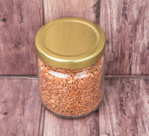 Brown millet in a jar — Stock Photo, Image