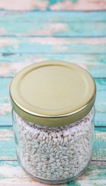 White millet in mason jar — Stock Photo, Image