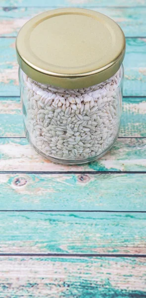 White millet in mason jar — Stock Photo, Image