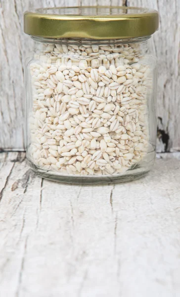 White millet in mason jar — Stock Photo, Image