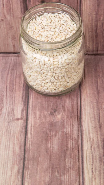 White millet in mason jar — Stock Photo, Image