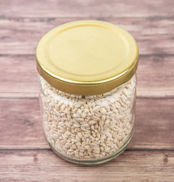 White millet in mason jar — Stock Photo, Image