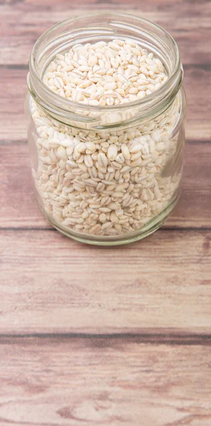 White millet in mason jar — Stock Photo, Image