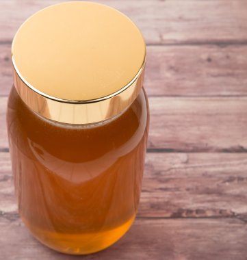 Uzun boylu kavanoz bal