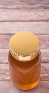 Uzun boylu kavanoz bal