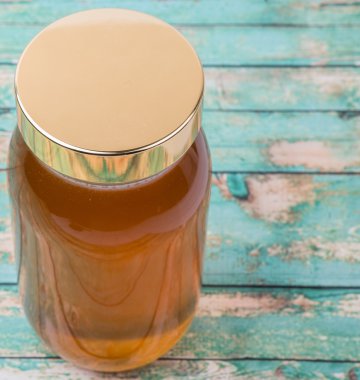 Uzun boylu kavanoz bal