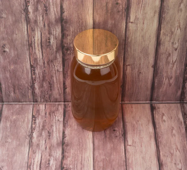 Honey In Tall Jar — Stock Photo, Image