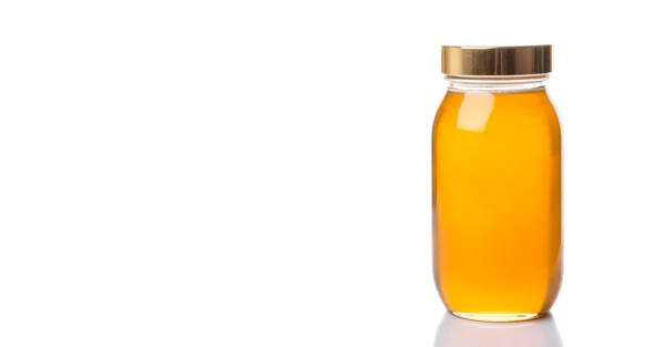 Honey In Tall Jar — Stock Photo, Image